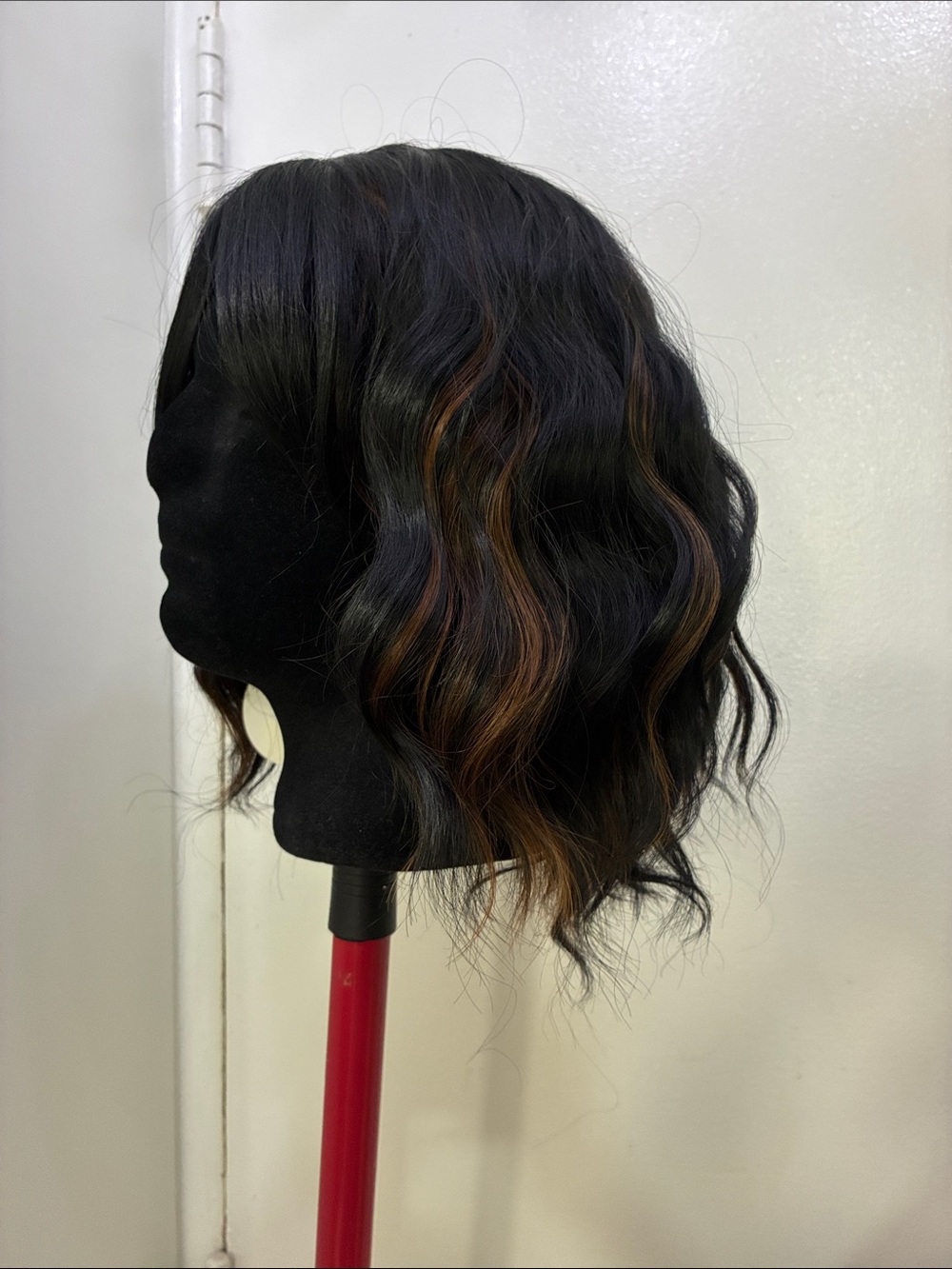 Short black synthetic wig with highlights